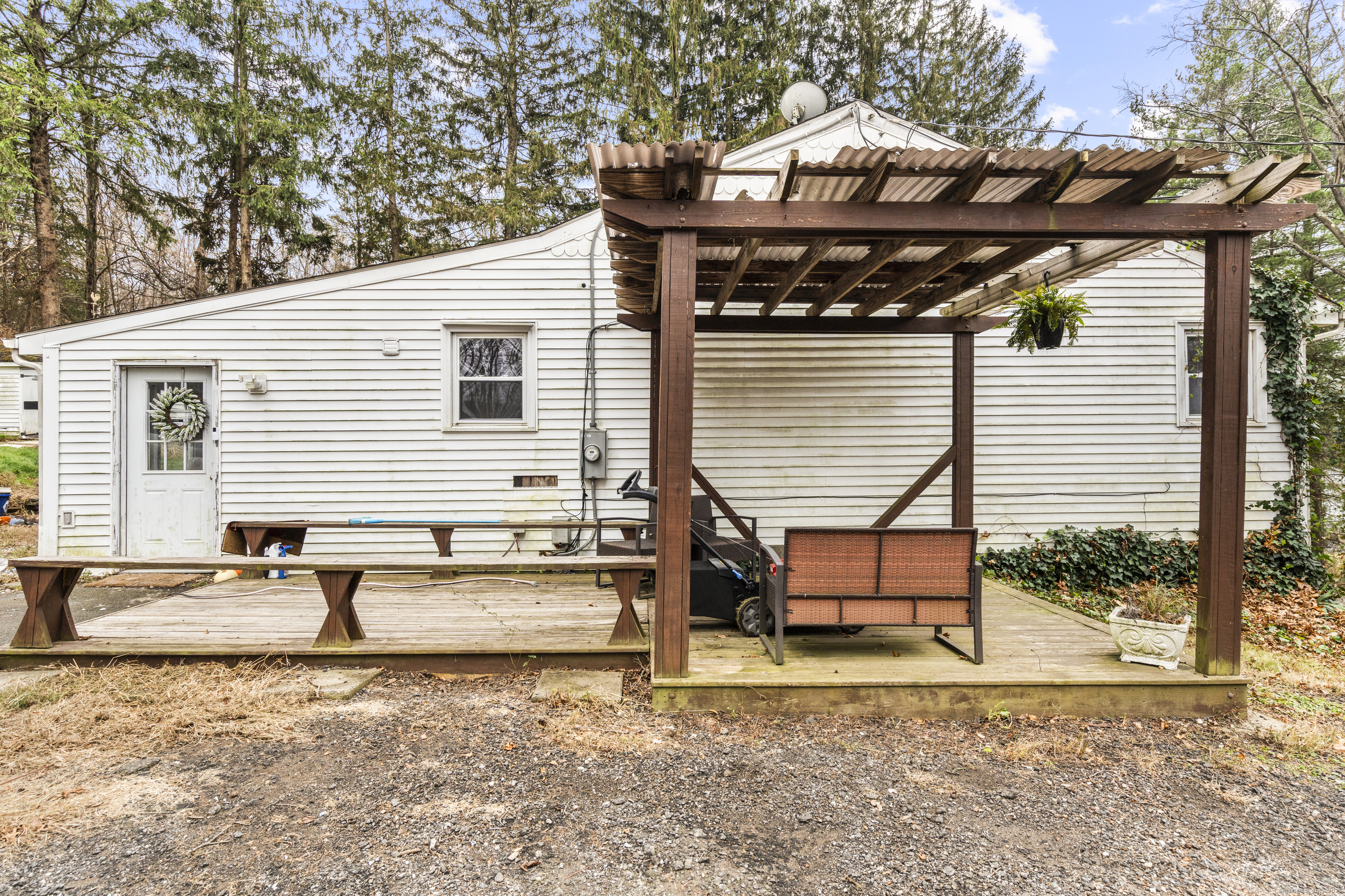 523 Chamberlain Hill Road Haddam, CT 06441 - Photo 37 of 38 a backyard of a house with seating space