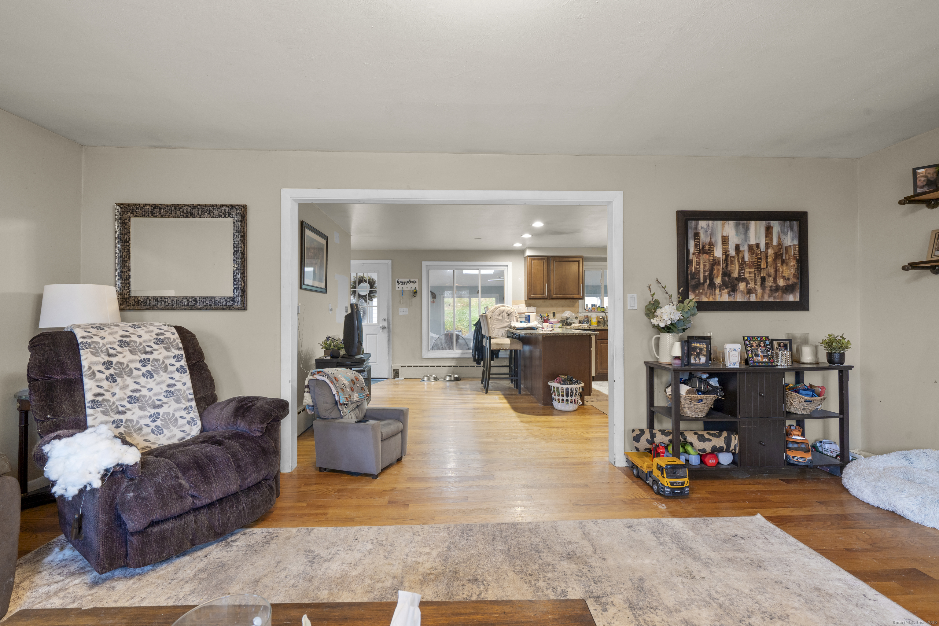 523 Chamberlain Hill Road Haddam, CT 06441 - Photo 6 of 38 a living room with furniture and a wooden floor
