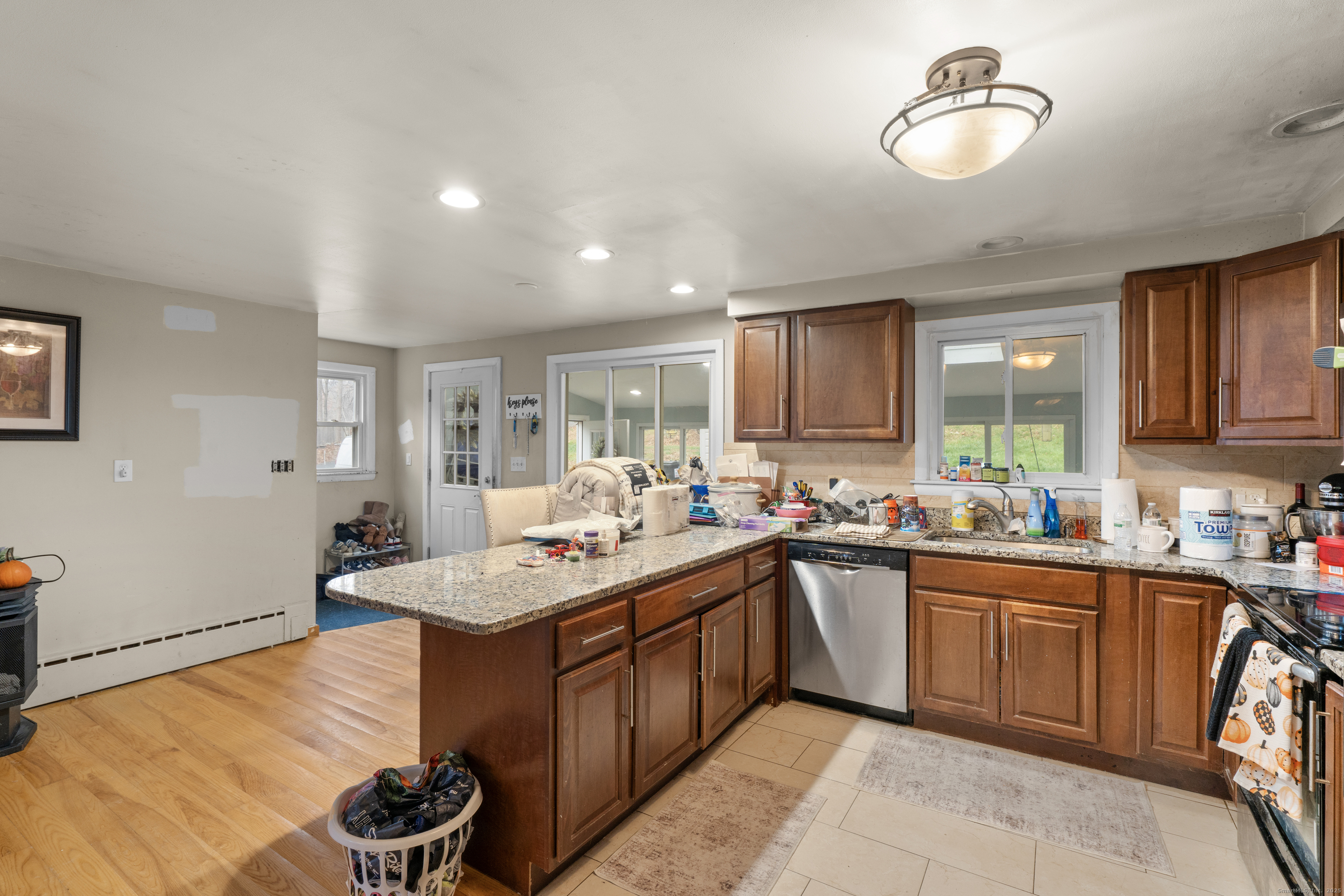 523 Chamberlain Hill Road Haddam, CT 06441 - Photo 9 of 38 a kitchen with a sink a stove and cabinets