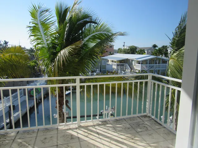 a view of a balcony with floor to ceiling window and outdoor space