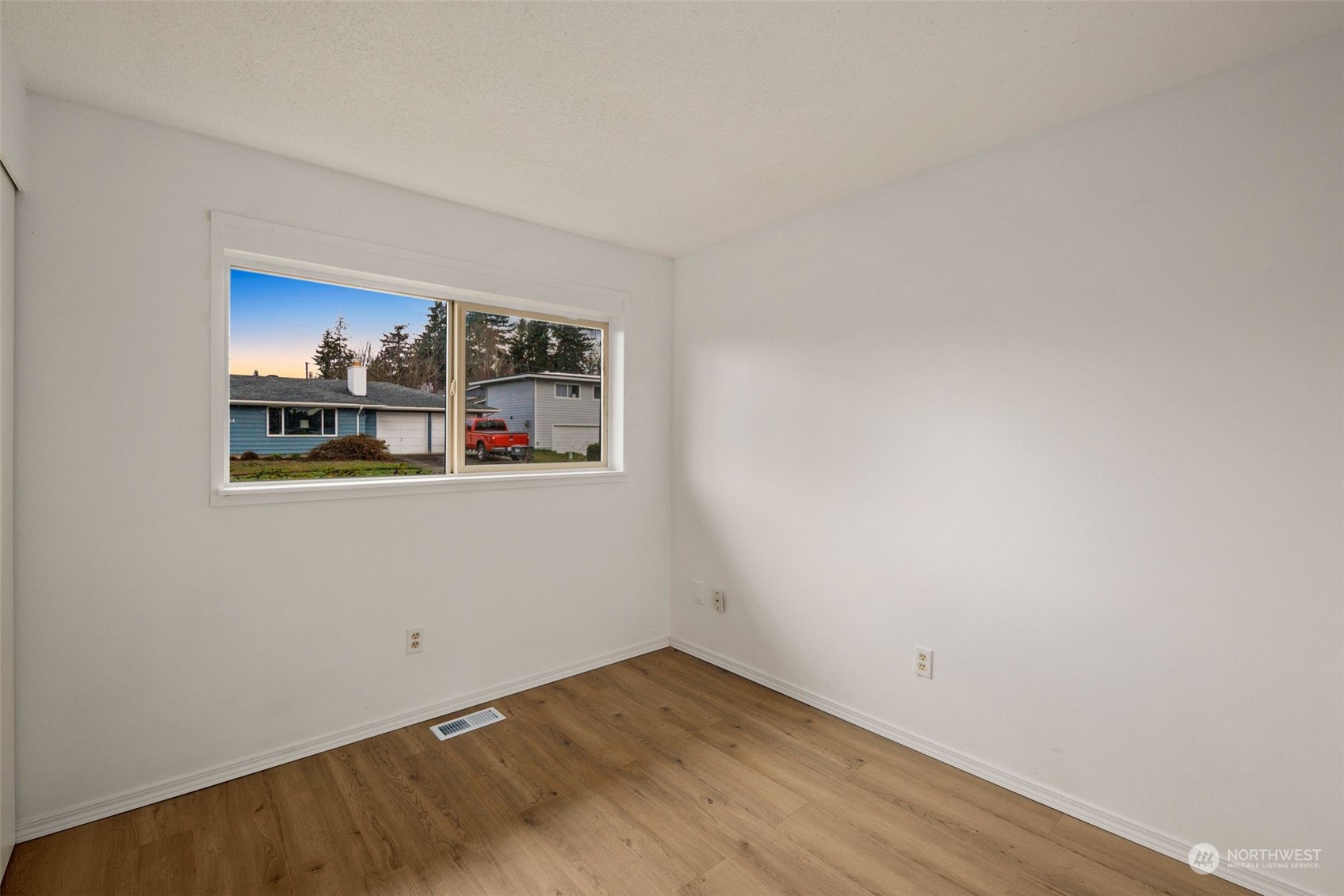 10705 Southeast 236th Place Kent, WA 98031 - Photo 11 of 36 a view of a room with window and hardwood floor