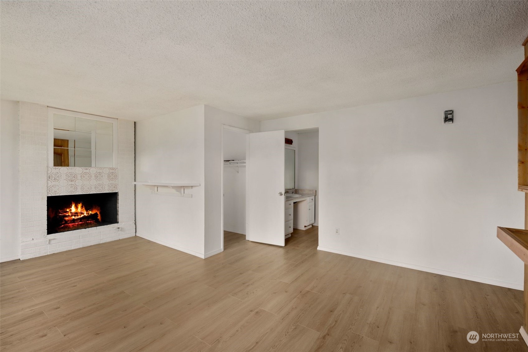 10705 Southeast 236th Place Kent, WA 98031 - Photo 15 of 36 a view of a livingroom with a fireplace and a window