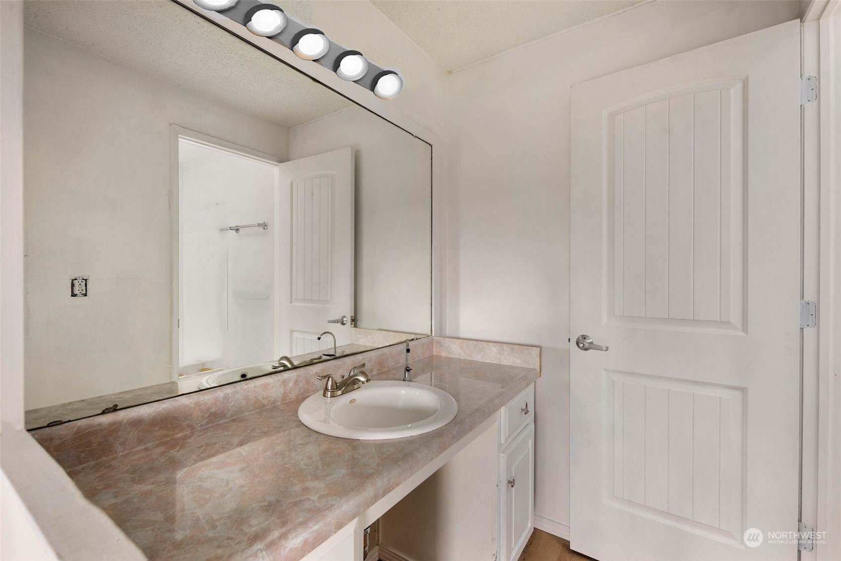 10705 Southeast 236th Place Kent, WA 98031 - Photo 18 of 36 a bathroom with a sink and a mirror