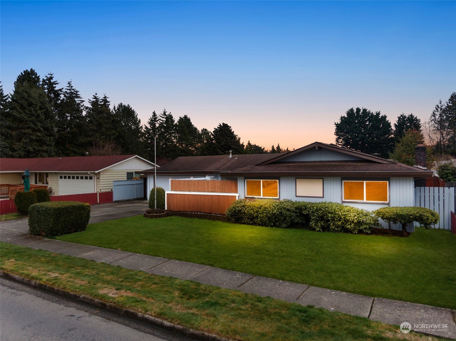 10705 Southeast 236th Place Kent, WA 98031 - Photo 2 of 36 a front view of a house with a garden