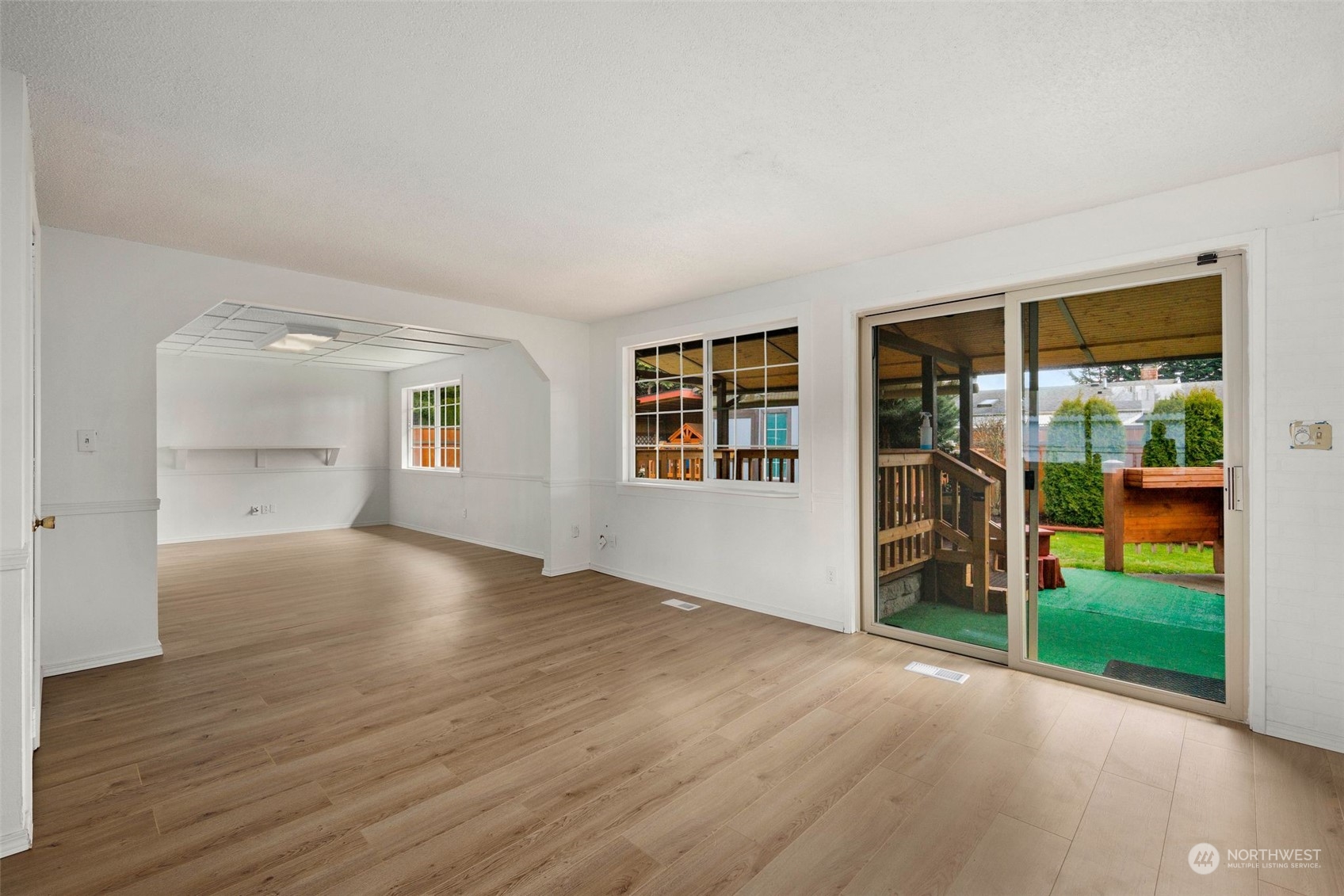10705 Southeast 236th Place Kent, WA 98031 - Photo 22 of 36 wooden floor in an empty room with a window