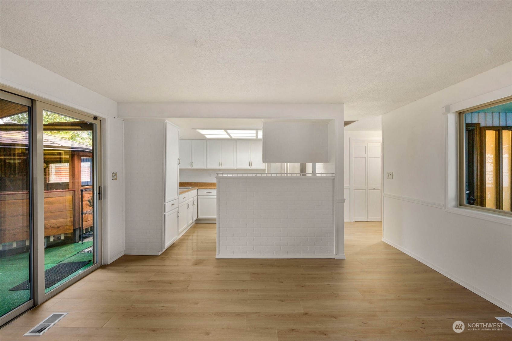 10705 Southeast 236th Place Kent, WA 98031 - Photo 25 of 36 a view of a kitchen cabinets and a wooden floor