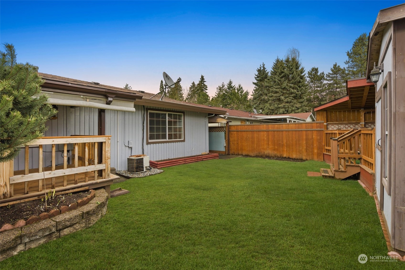 10705 Southeast 236th Place Kent, WA 98031 - Photo 30 of 36 a view of a backyard with a small cabin