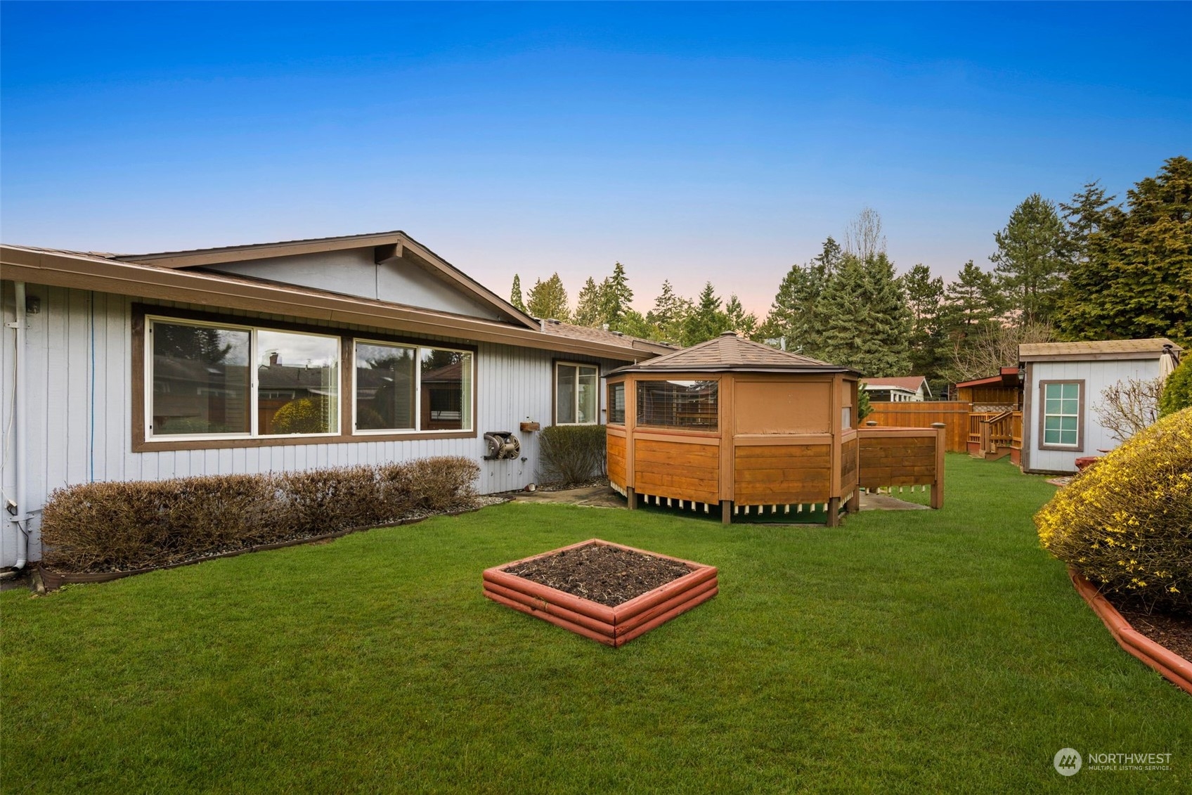 10705 Southeast 236th Place Kent, WA 98031 - Photo 32 of 36 a front view of a house with a garden