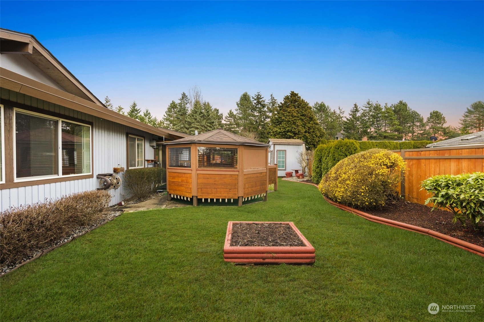10705 Southeast 236th Place Kent, WA 98031 - Photo 33 of 36 a front view of a house with a garden