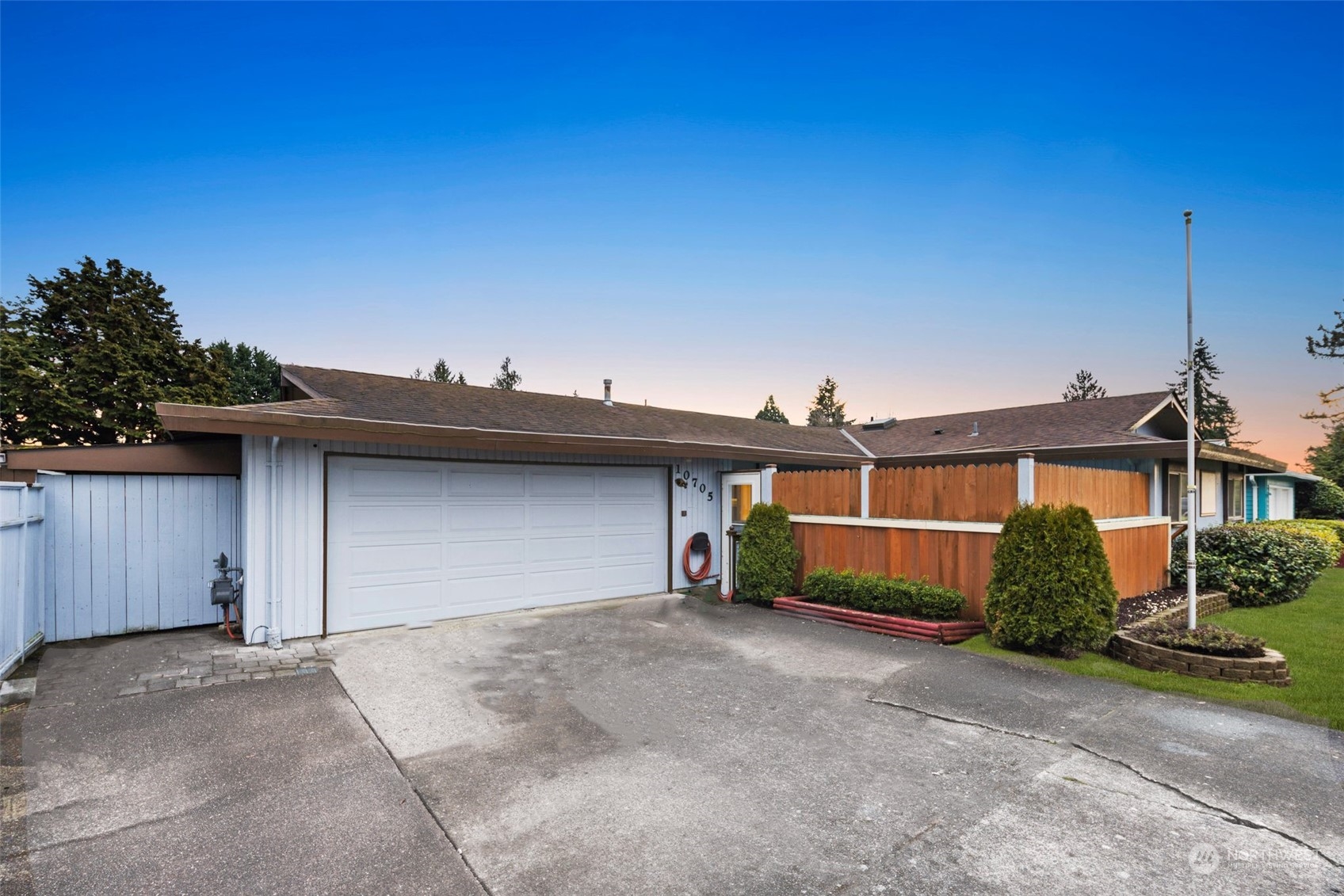 10705 Southeast 236th Place Kent, WA 98031 - Photo 5 of 36 a view of a house with a yard and plants