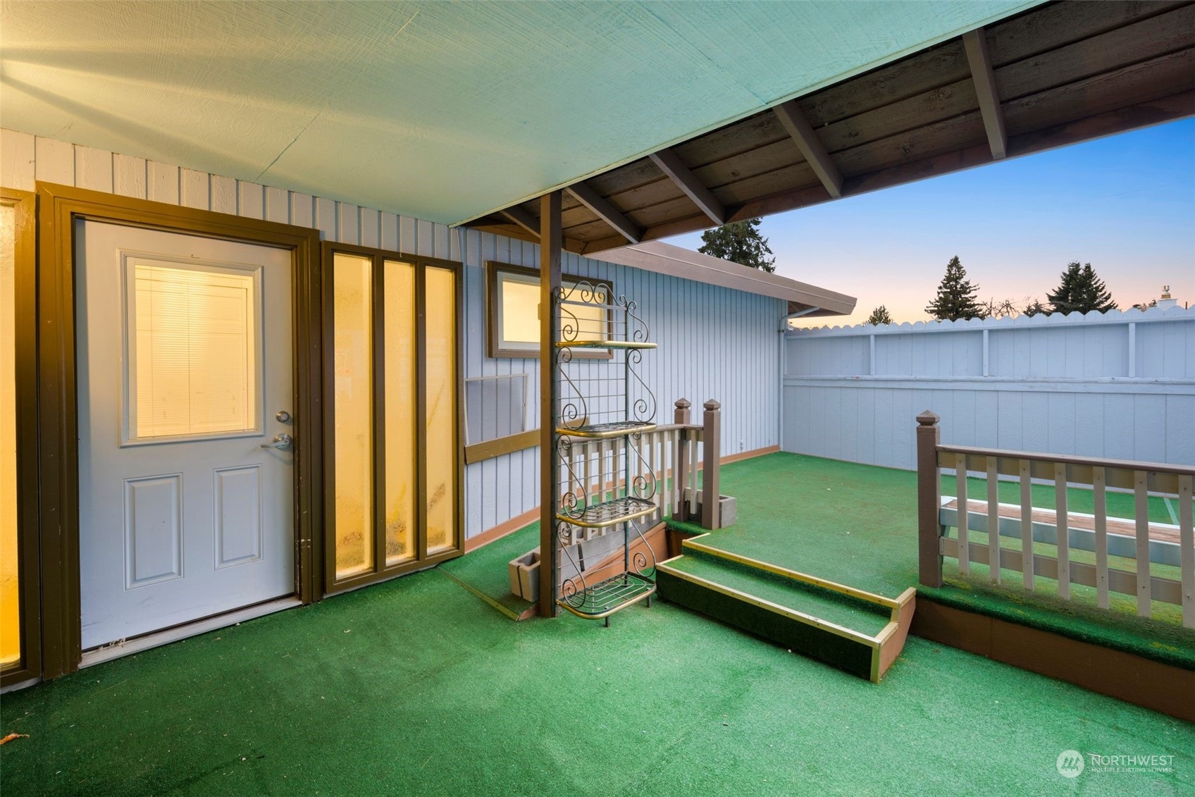 10705 Southeast 236th Place Kent, WA 98031 - Photo 6 of 36 a view of a backyard with a garden and deck