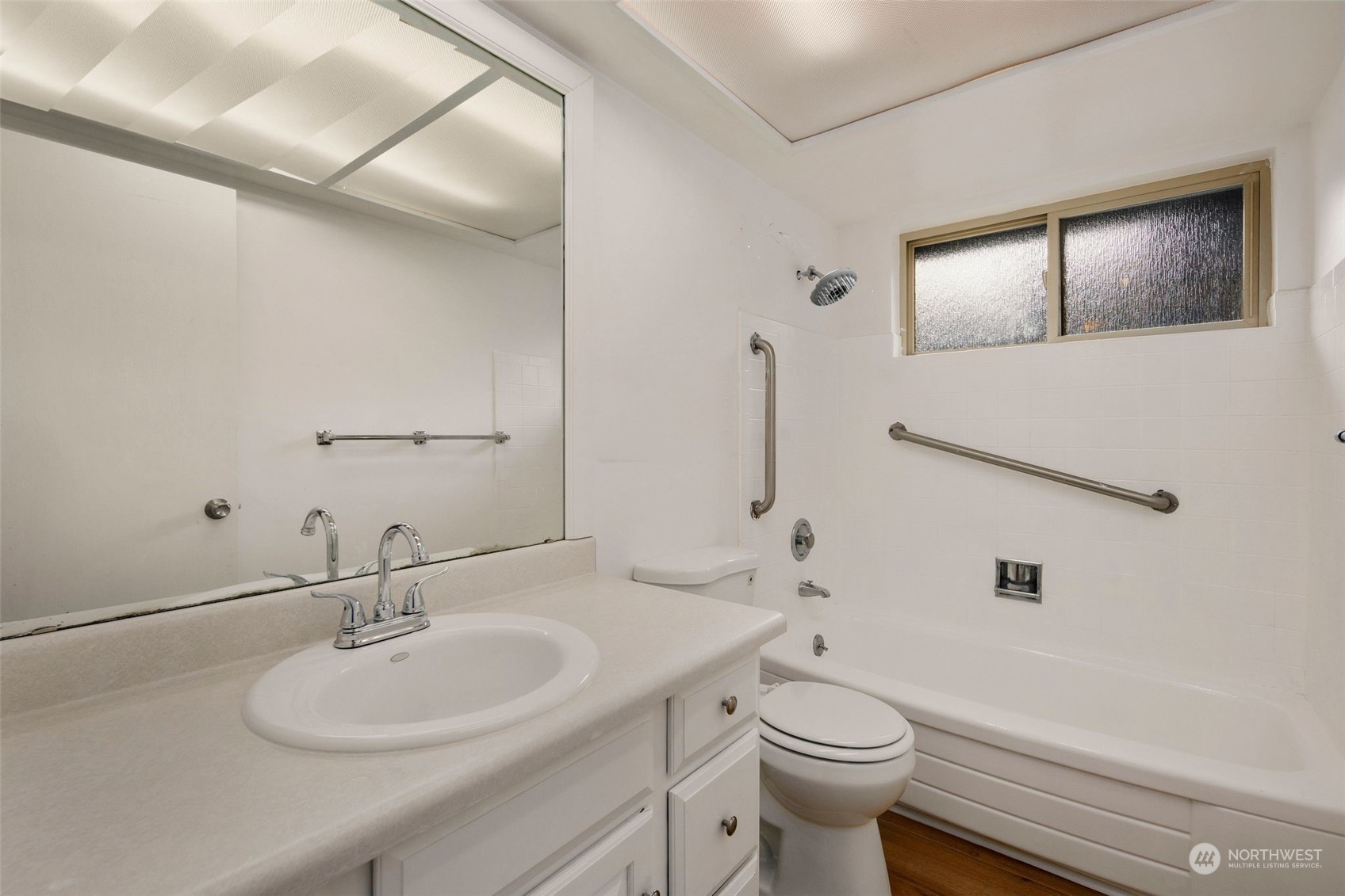 10705 Southeast 236th Place Kent, WA 98031 - Photo 9 of 36 a bathroom with a toilet a sink and mirror