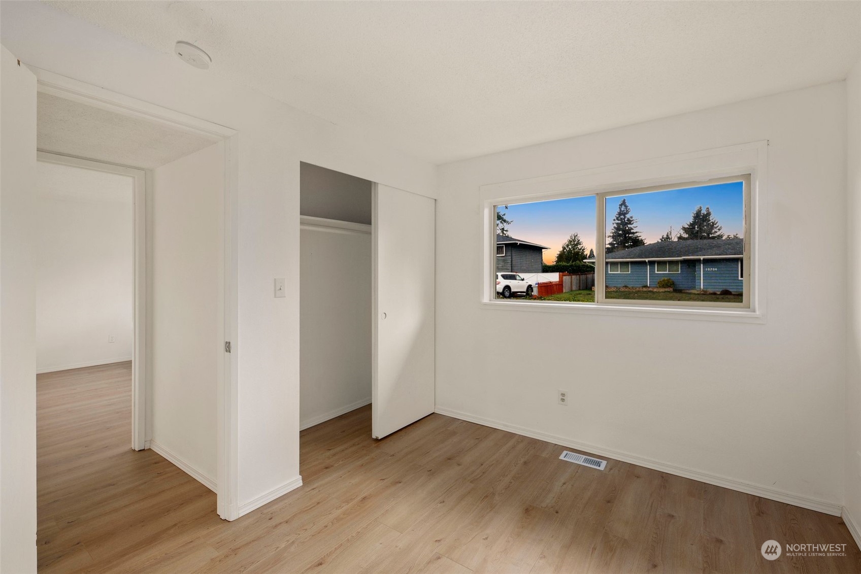 10705 Southeast 236th Place Kent, WA 98031 - Photo 10 of 36 a view of a livingroom with wooden floor and closet
