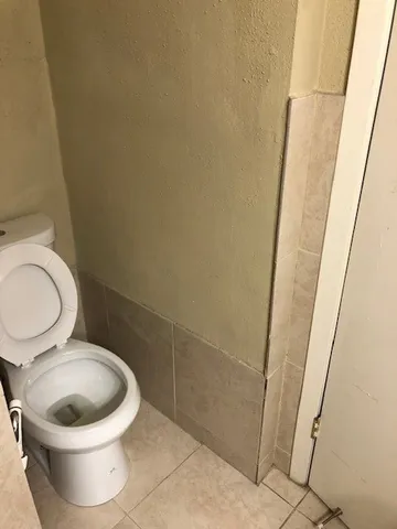 a close up of a toilet and a sink