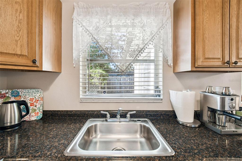 10801 Bethel Street Port Richey, FL 34668 - Photo 14 of 28 a bathroom with a sink a bathtub and next to window