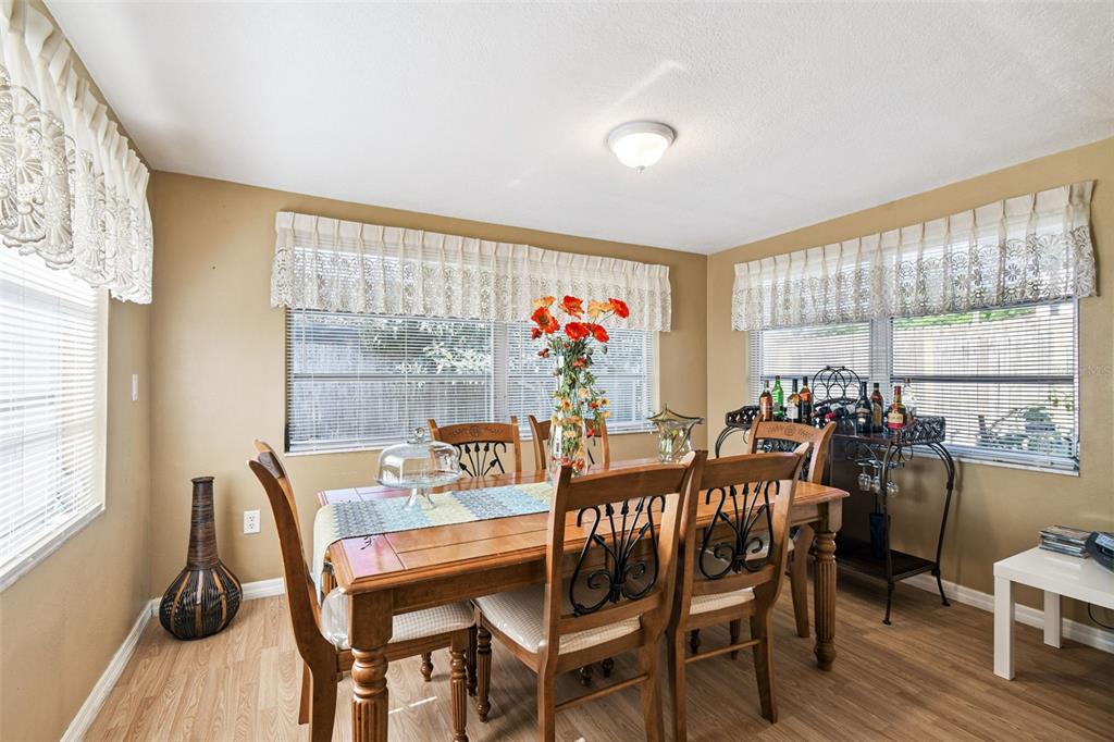 10801 Bethel Street Port Richey, FL 34668 - Photo 15 of 28 a view of a dining room with furniture window and outside view