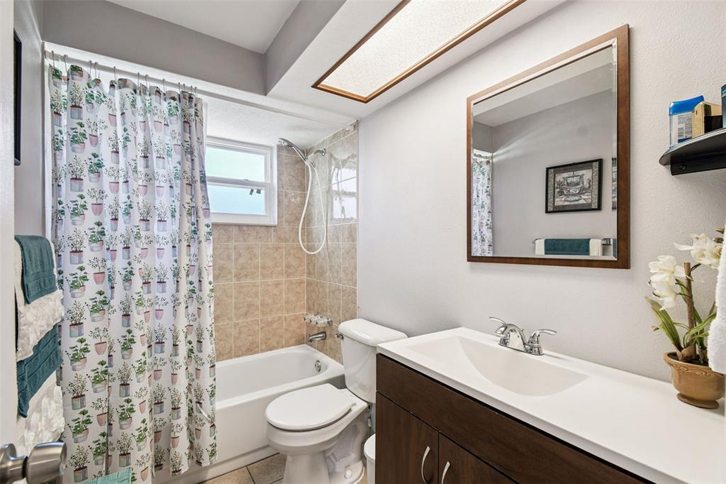 10801 Bethel Street Port Richey, FL 34668 - Photo 20 of 28 a bathroom with a sink a toilet and shower