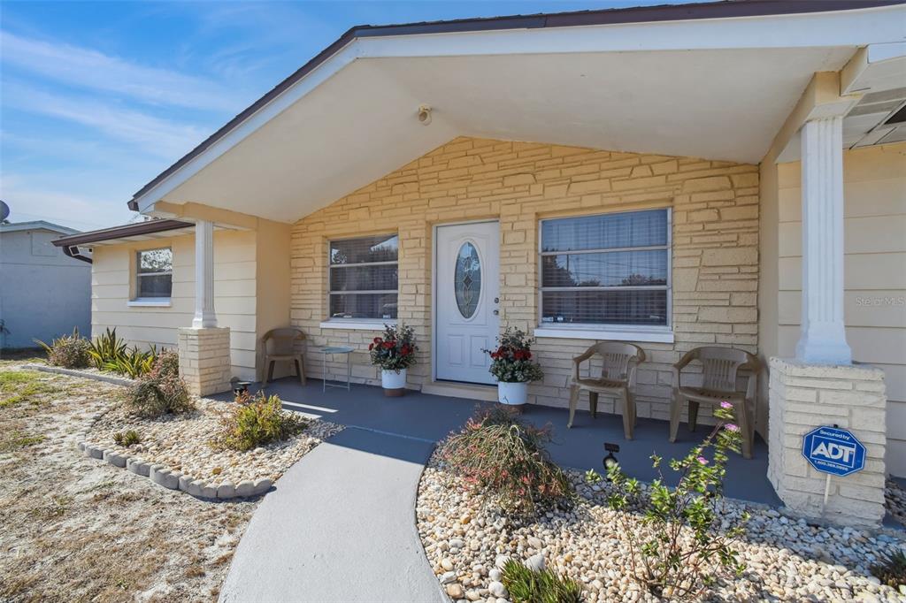10801 Bethel Street Port Richey, FL 34668 - Photo 2 of 28 a view of a house with patio