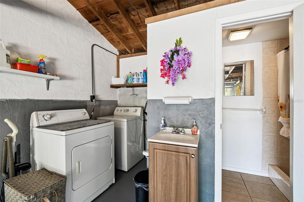 10801 Bethel Street Port Richey, FL 34668 - Photo 22 of 28 a utility room with dryer and washer