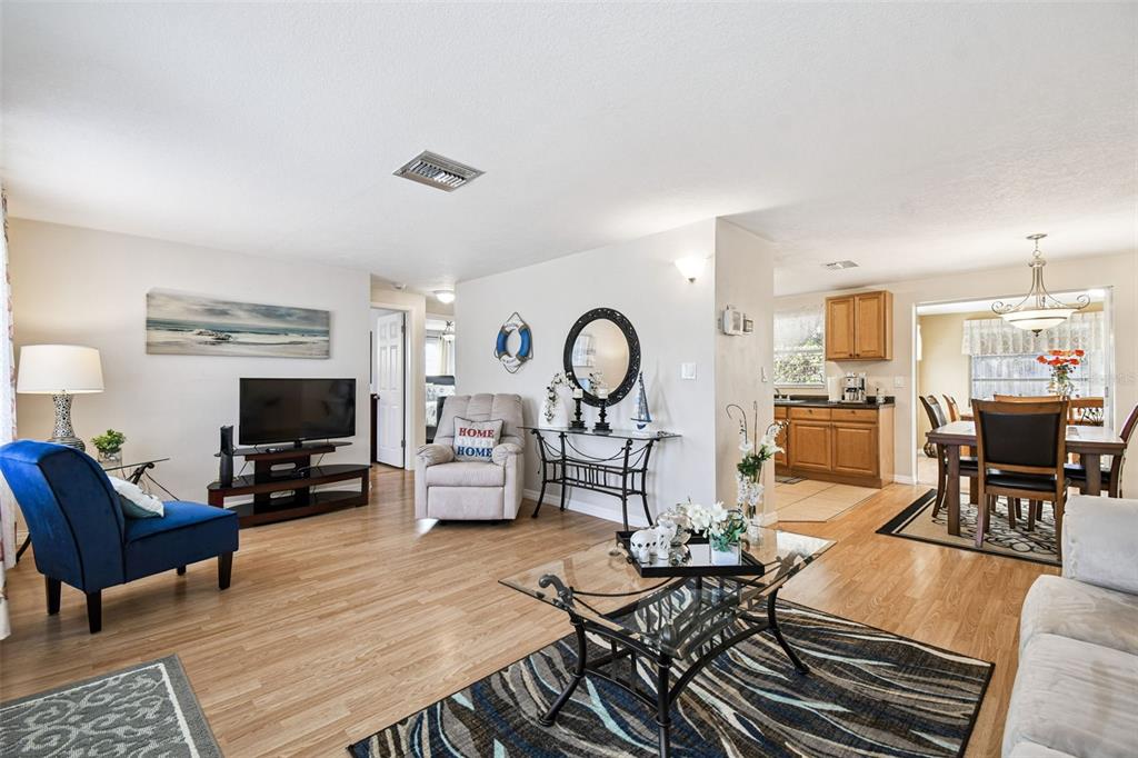 10801 Bethel Street Port Richey, FL 34668 - Photo 8 of 28 a living room with fireplace furniture and a flat screen tv
