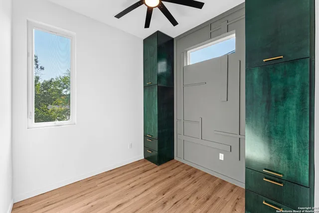 an empty room with closet and a bathroom