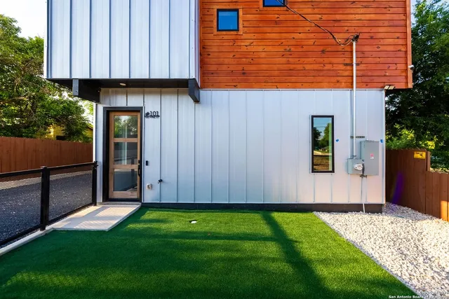 a view of a backyard with potted plants