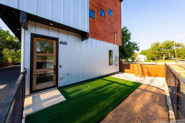 a view of a backyard with sitting area