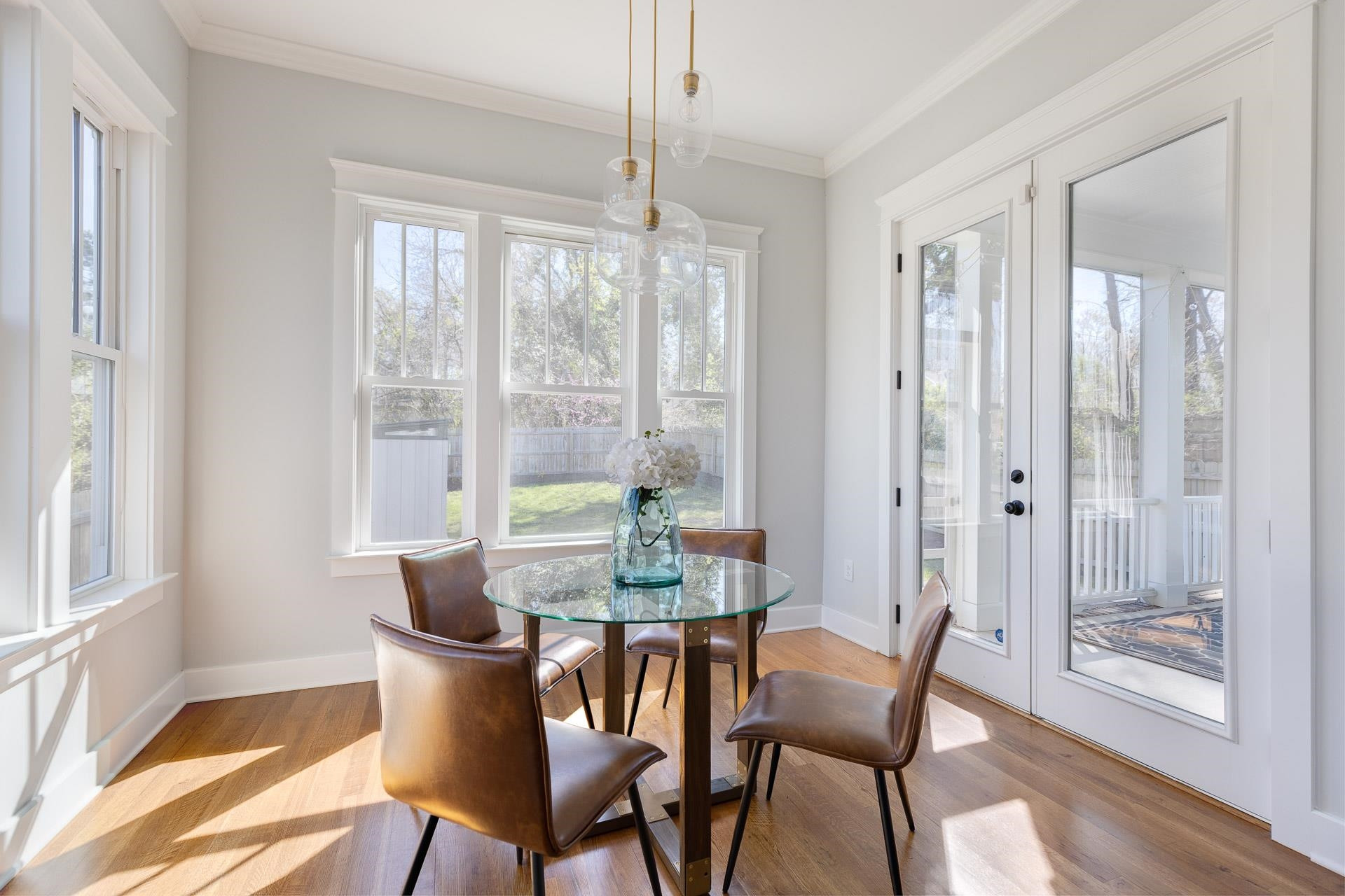 910 Sedgefield Street Durham, NC 27705 - Photo 12 of 39 a dining room with furniture a chandelier and wooden floor
