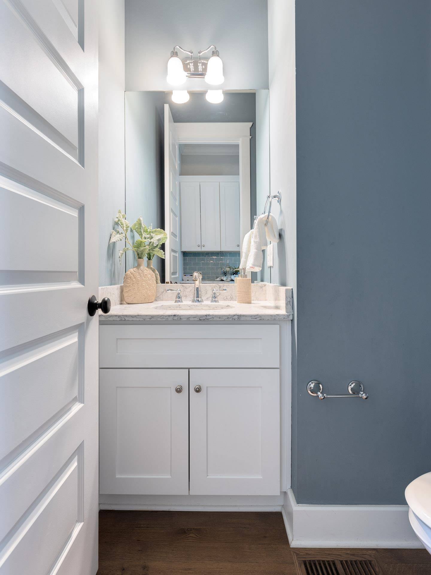 910 Sedgefield Street Durham, NC 27705 - Photo 18 of 39 a bathroom with a sink vanity granite and toilet