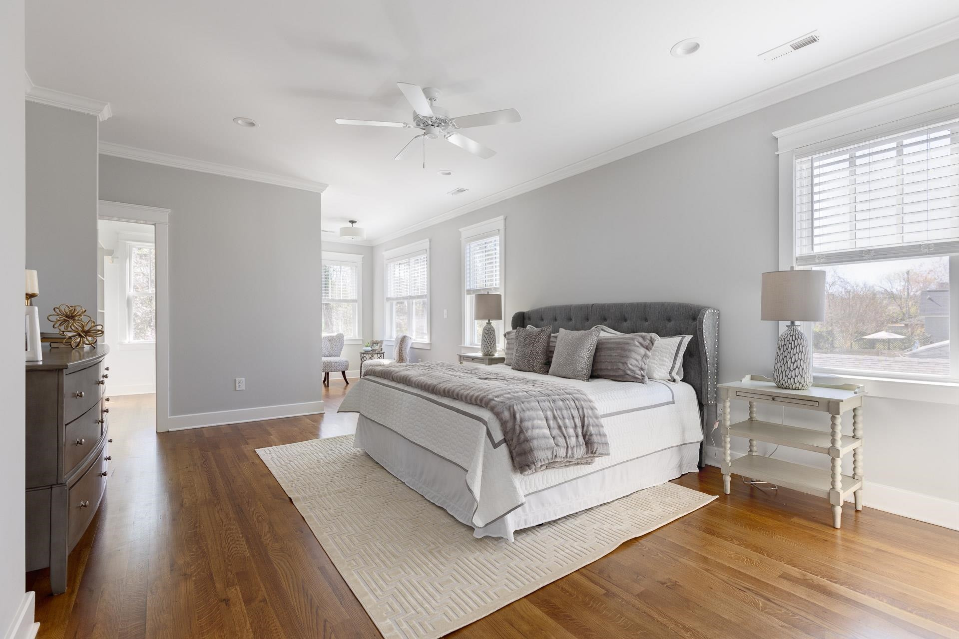 910 Sedgefield Street Durham, NC 27705 - Photo 19 of 39 a spacious bedroom with a bed and a table in it