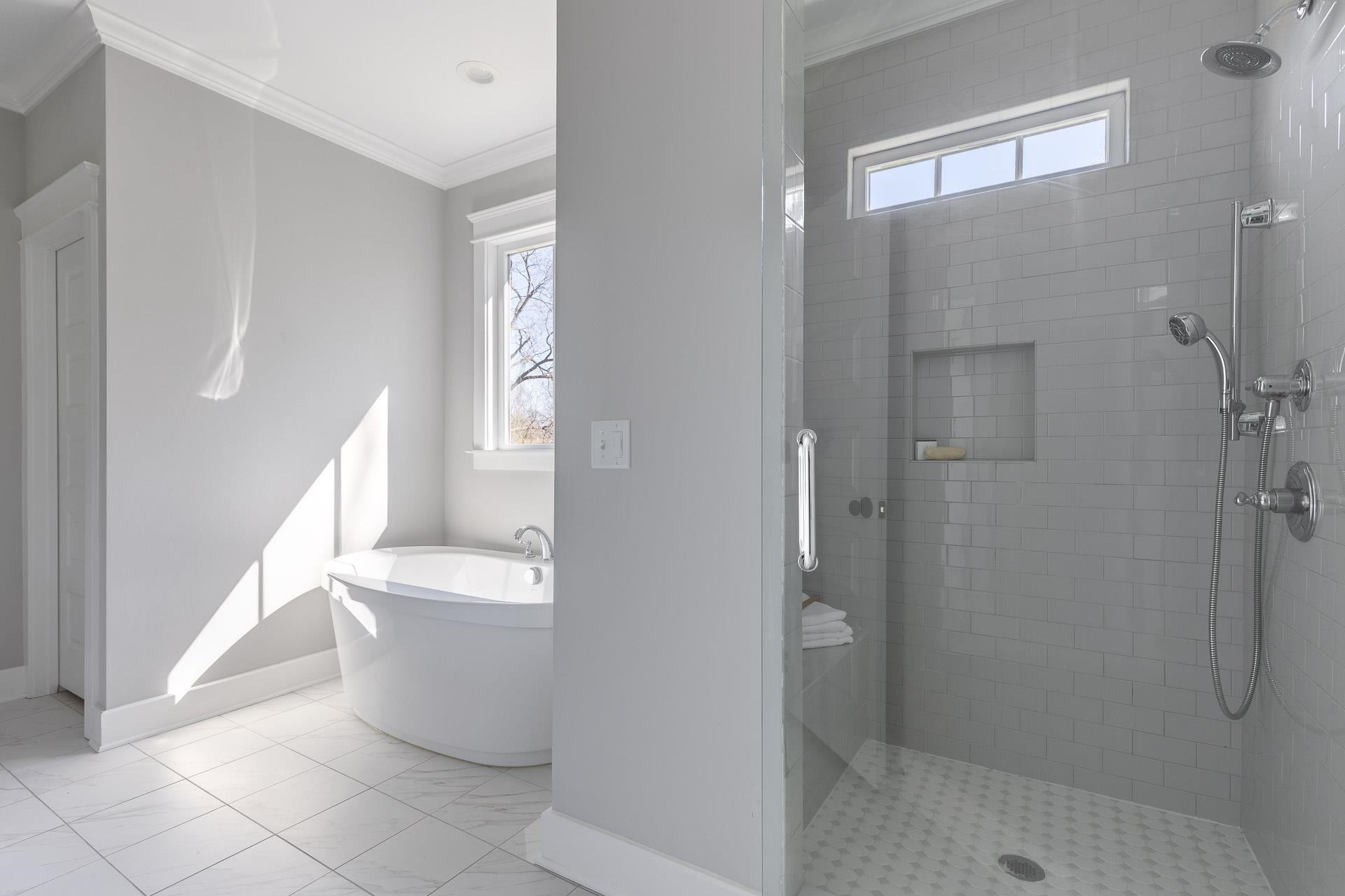 910 Sedgefield Street Durham, NC 27705 - Photo 25 of 39 a bathroom with a bathtub and shower