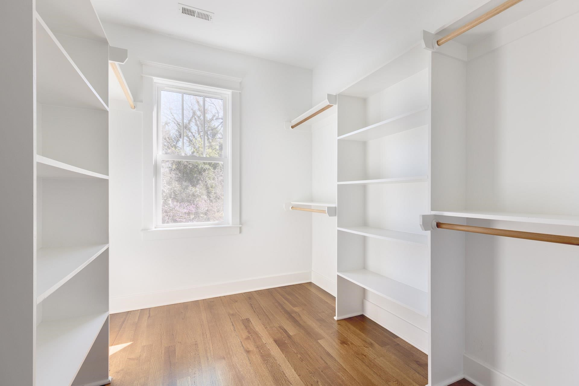 910 Sedgefield Street Durham, NC 27705 - Photo 27 of 39 a view of an empty room with wooden floor and a window