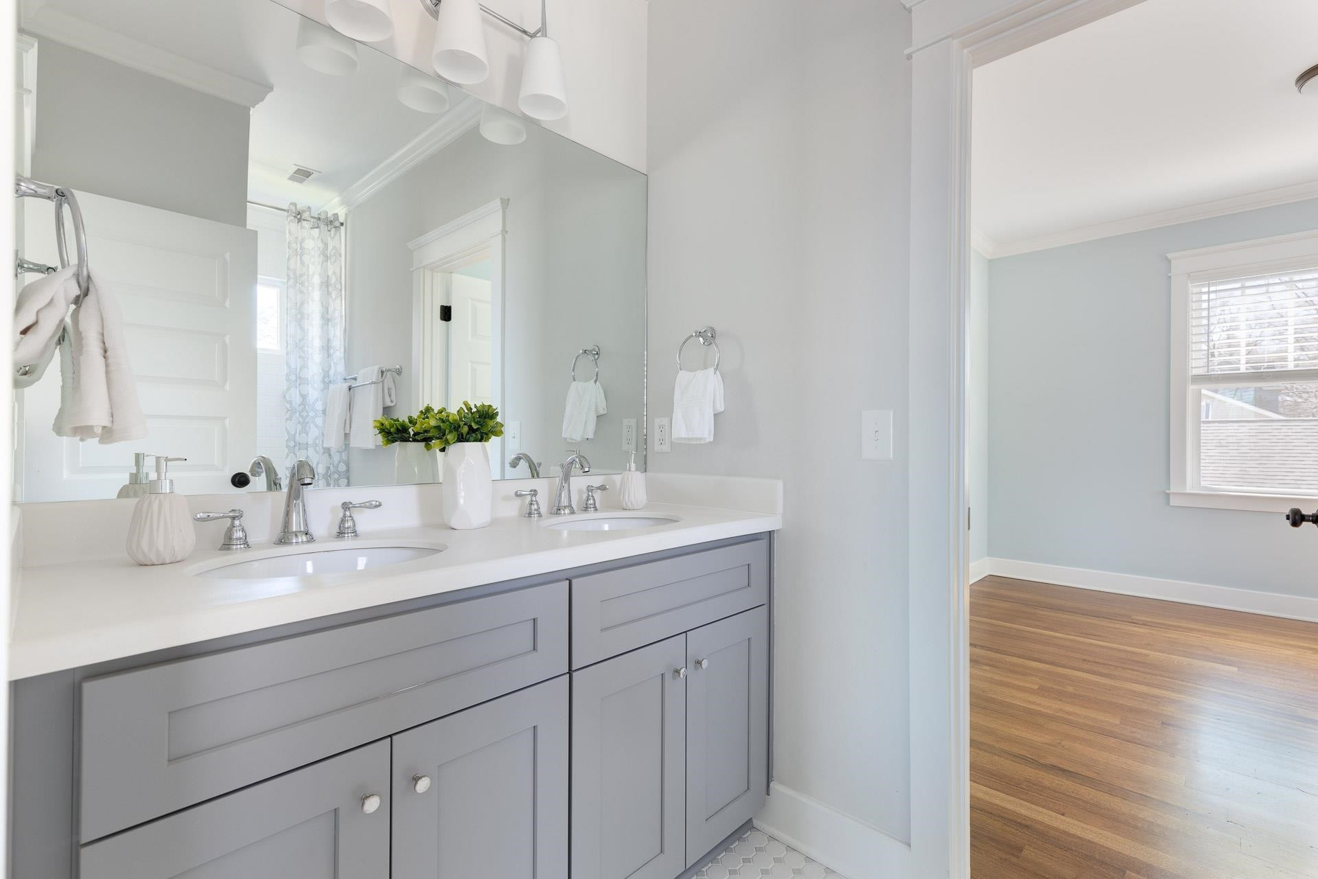 910 Sedgefield Street Durham, NC 27705 - Photo 30 of 39 a bathroom with a sink and a mirror