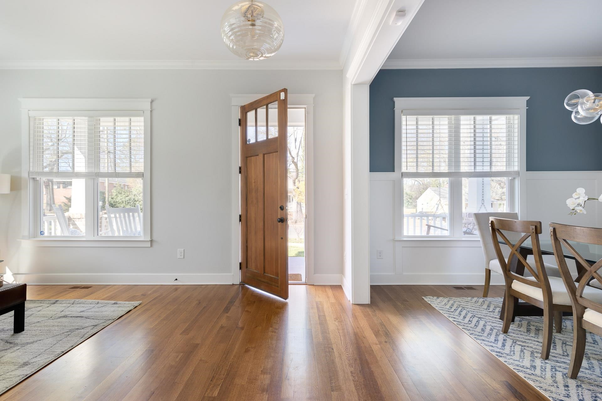 910 Sedgefield Street Durham, NC 27705 - Photo 4 of 39 an empty room with wooden floor and windows