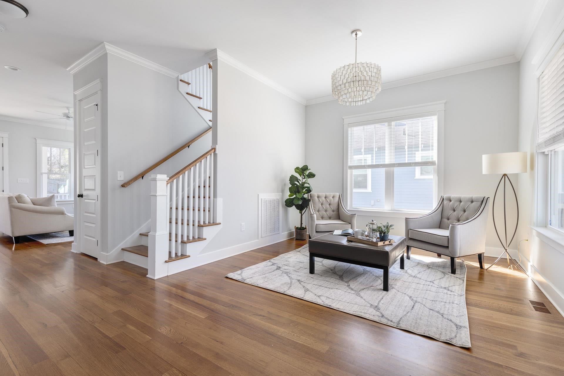 910 Sedgefield Street Durham, NC 27705 - Photo 5 of 39 a living room with furniture two window and wooden floor