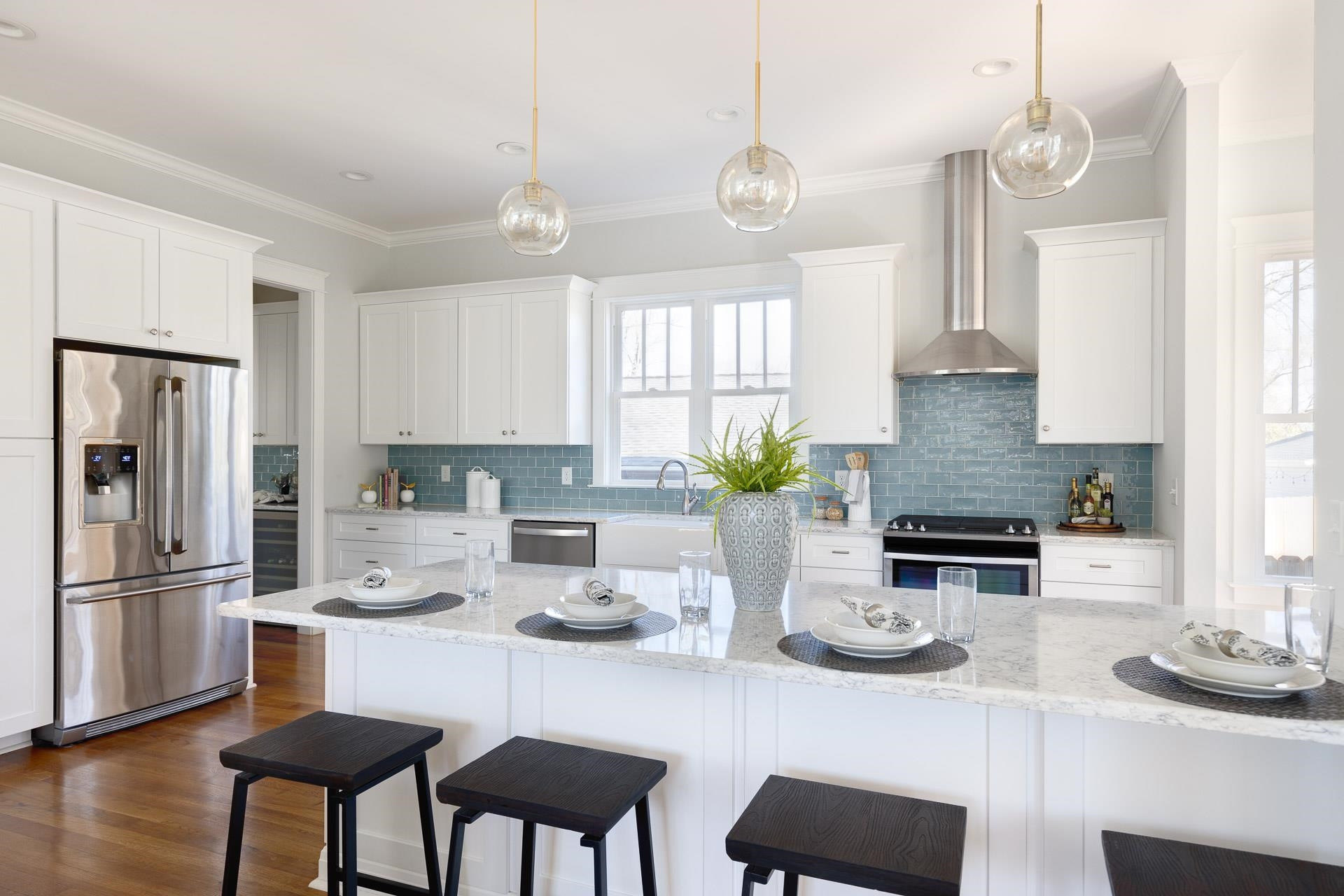 910 Sedgefield Street Durham, NC 27705 - Photo 9 of 39 a kitchen with stainless steel appliances granite countertop a sink refrigerator and cabinets