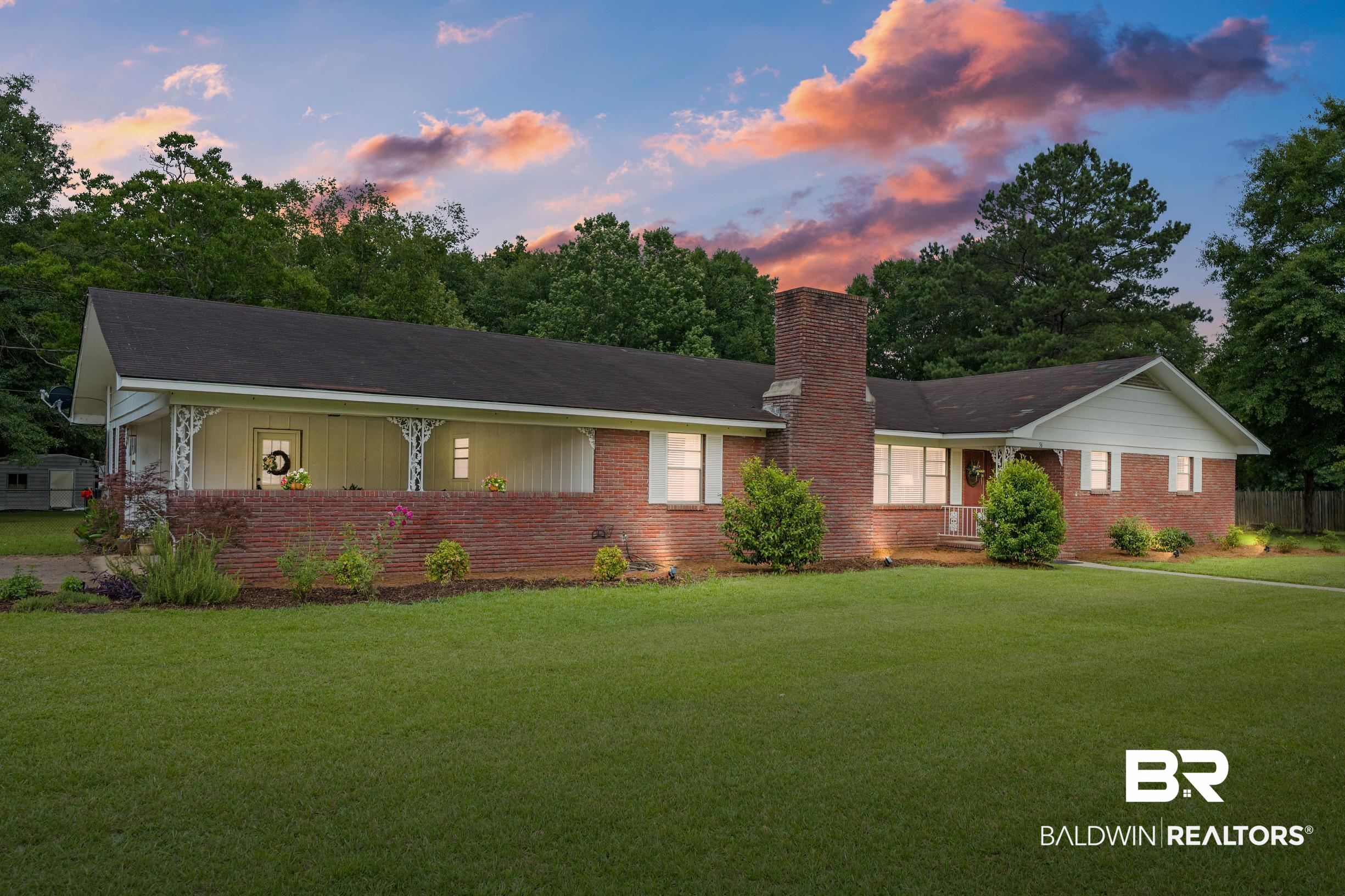 56 Old Bratt Road Atmore, AL 36502 - Photo 3 of 37 Ranch-style house featuring brick siding, a yard, and a chimney