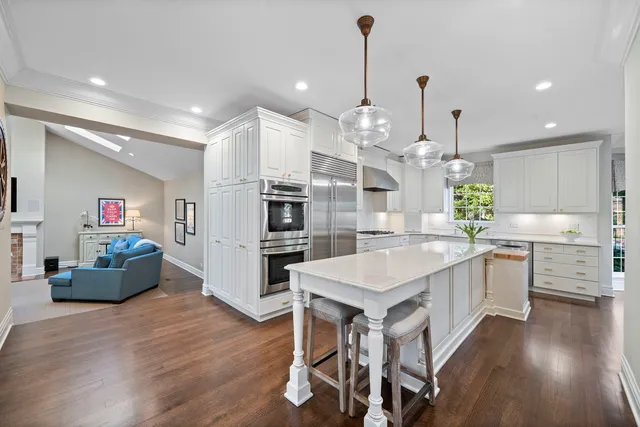 a view of a house with backyard sitting area and garden