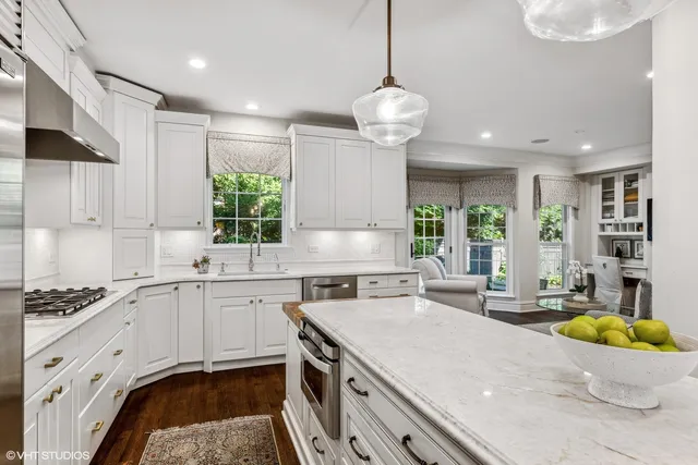 a view of a house with backyard sitting area and garden