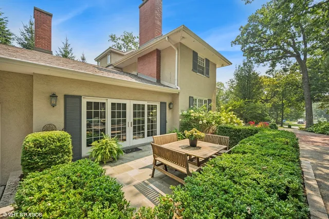 a view of a house with a yard and garden
