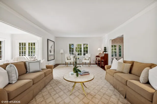 a kitchen with stainless steel appliances kitchen island wooden floors refrigerator and cabinets