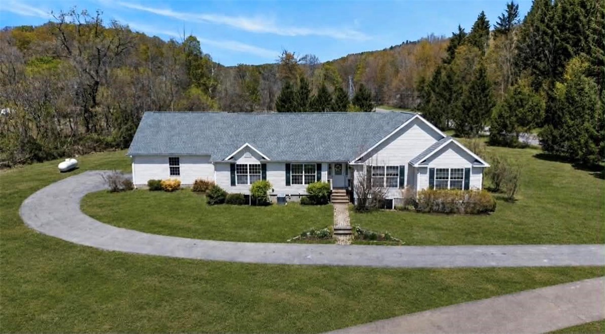 8628 Garlinghouse Road Naples, NY 14512 - Photo 1 of 48 AI used to show yard potential with green grass.