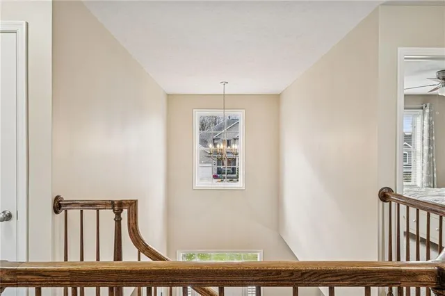 a bedroom with a bed a couch and dresser