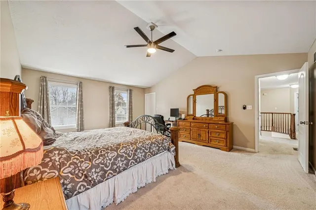 a view of a hallway to rooms and stairs