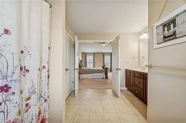 a bathroom with a granite countertop sink mirror and double