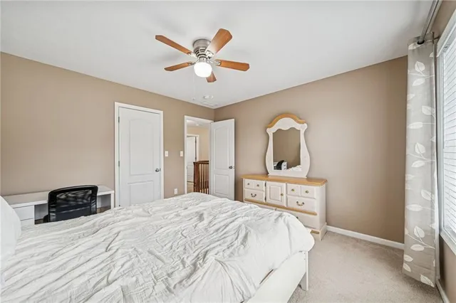 a bedroom with a bed and dresser