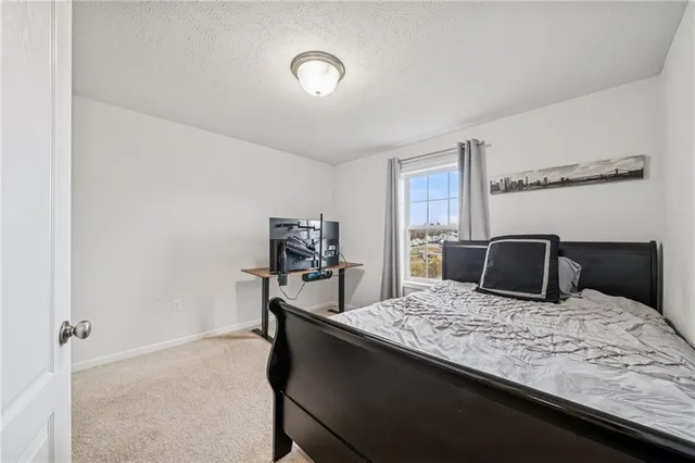 a bedroom with a bed and furniture