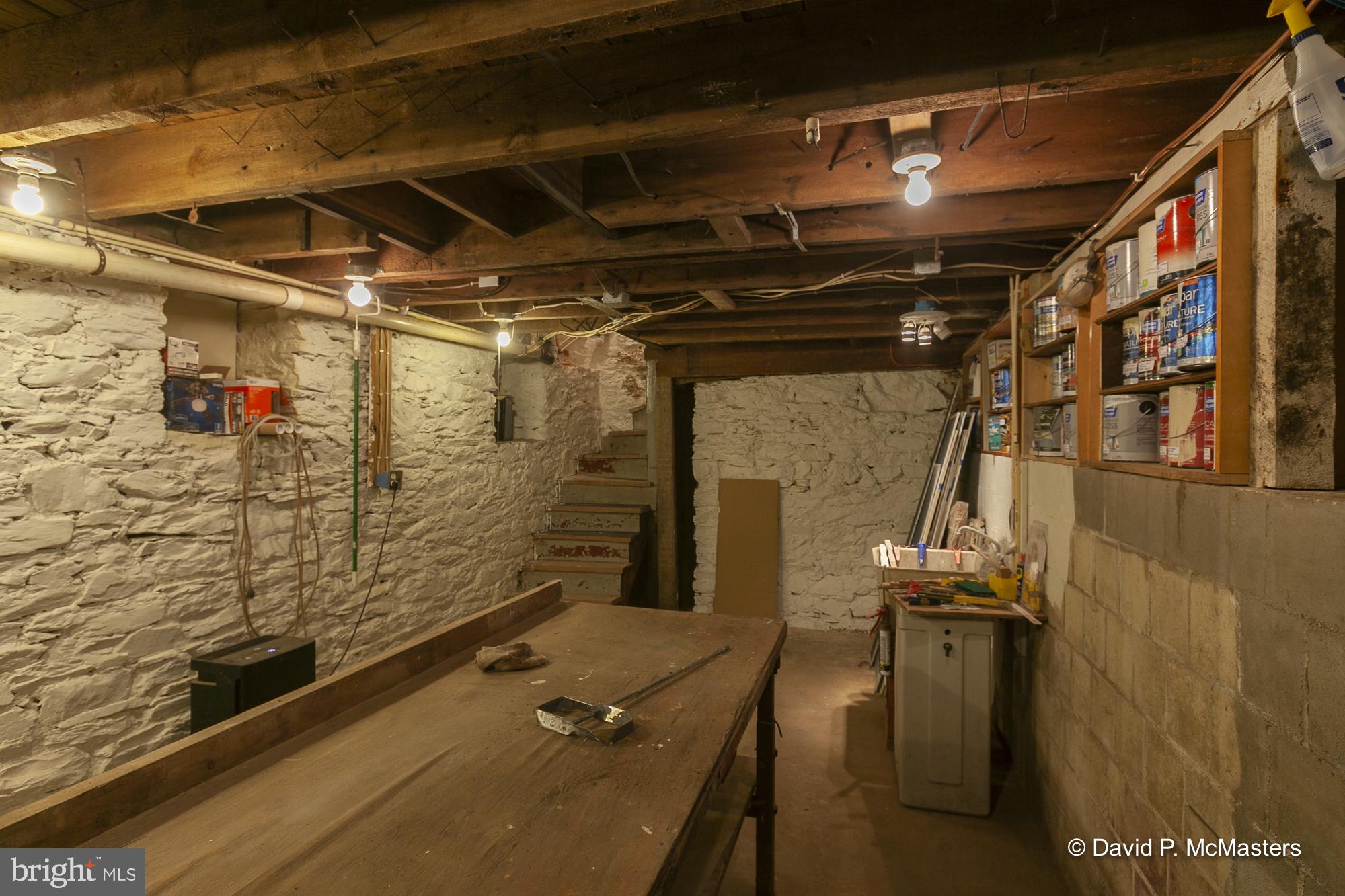 3632 Vineyard Road Falling Waters, WV 25419 - Photo 30 of 56 Basement - stone walls/ Workshop shelving