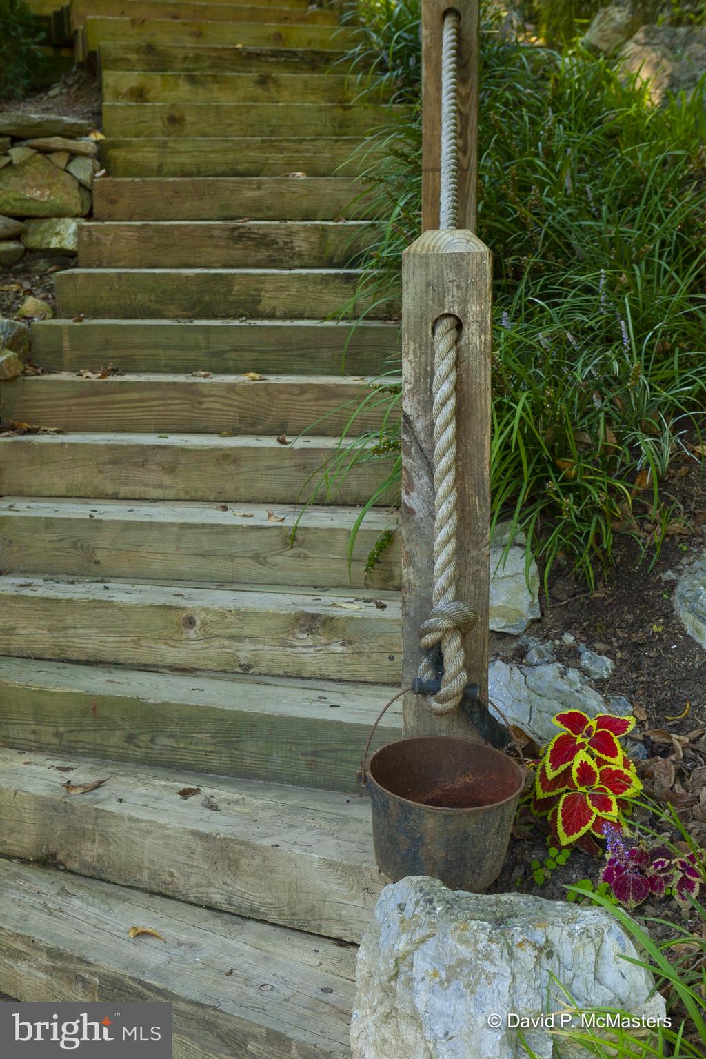 3632 Vineyard Road Falling Waters, WV 25419 - Photo 53 of 56 Stairway to rear concrete patio w/ rock encasement