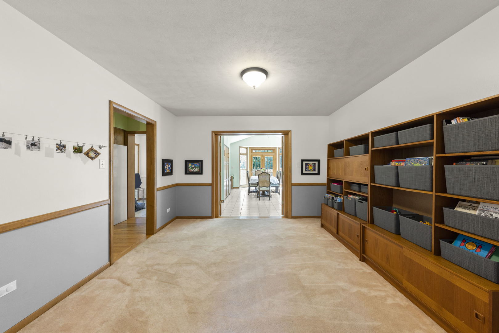 N521 Willow Road Wheaton, IL 60187 - Photo 18 of 64 a view of a hallway with wooden floor and windows